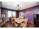 Dining room with hardwood floors, a globe chandelier, and natural light from a nearby window at 2141 E County Road 200 N, Danville, IN 46122