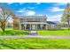 Inviting two-story home featuring a spacious front yard with beautiful landscaping and inviting front porch at 2141 E County Road 200 N, Danville, IN 46122
