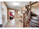 Spacious foyer showcasing tile flooring, wooden staircase, and an open layout, enhancing the home's appeal at 2141 E County Road 200 N, Danville, IN 46122