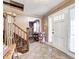 Welcoming foyer with tile flooring, staircase, and charming details creating a warm and inviting atmosphere at 2141 E County Road 200 N, Danville, IN 46122