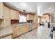 Bright kitchen with ample counter space, wooden cabinetry, and tile flooring for easy maintenance at 2141 E County Road 200 N, Danville, IN 46122