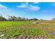 Image of vast open land and feeding station with small puddles of water in the ground at 2141 E County Road 200 N, Danville, IN 46122