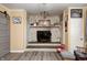 Living room featuring a brick fireplace, media center, and neutral paint tones at 2141 E County Road 200 N, Danville, IN 46122