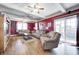 Cozy living room with hardwood floors, comfortable seating, and abundant natural light, ideal for relaxation at 2141 E County Road 200 N, Danville, IN 46122