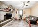 Inviting living room with a brick fireplace, cozy seating, and neutral decor at 2141 E County Road 200 N, Danville, IN 46122
