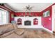 Inviting living room highlighting a white brick fireplace, hardwood floors, and plenty of natural light at 2141 E County Road 200 N, Danville, IN 46122