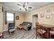 Comfortable living room with a ceiling fan, ample seating, and access to the dining area at 2141 E County Road 200 N, Danville, IN 46122
