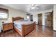 This primary bedroom has beautiful wood floors, a ceiling fan, and beautiful wood trim throughout at 2141 E County Road 200 N, Danville, IN 46122