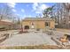 Backyard featuring a patio area, built-in benches, and a fire pit at 2253 W Coil St, Indianapolis, IN 46260