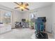 Comfortable bedroom with ample natural light, ceiling fan, and dedicated workspace at 2253 W Coil St, Indianapolis, IN 46260