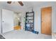 Cozy bedroom featuring neutral tones, soft carpet, and access to the hall at 2253 W Coil St, Indianapolis, IN 46260