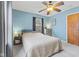 Tranquil bedroom with soft blue walls, neutral carpet, and natural light from two windows at 2253 W Coil St, Indianapolis, IN 46260