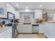 Bright kitchen features white cabinetry, modern appliances, and a window above the sink at 2253 W Coil St, Indianapolis, IN 46260