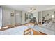 Spacious living room featuring hardwood floors, a ceiling fan, and plenty of natural light at 2253 W Coil St, Indianapolis, IN 46260