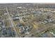 Aerial view of a residential neighborhood with tree-lined streets and a mix of homes and local businesses at 2406 Carrollton Ave, Indianapolis, IN 46205