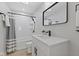 Modern bathroom featuring sleek fixtures, a walk-in shower, and a contemporary design at 2406 Carrollton Ave, Indianapolis, IN 46205