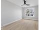 Bright bedroom with hardwood floors, a modern ceiling fan, and natural light at 2406 Carrollton Ave, Indianapolis, IN 46205
