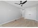 Spacious bedroom featuring hardwood floors, neutral walls, and closet with double doors at 2406 Carrollton Ave, Indianapolis, IN 46205
