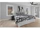 Nicely decorated bedroom with a black and white theme features hardwood floors and natural light at 2406 Carrollton Ave, Indianapolis, IN 46205