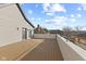 Expansive deck with wood flooring, white railing, and neighborhood views at 2406 Carrollton Ave, Indianapolis, IN 46205