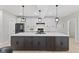 Spacious kitchen with a large central island, white cabinets, and modern appliances at 2406 Carrollton Ave, Indianapolis, IN 46205