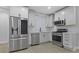 Modern kitchen with stainless steel appliances and white subway tile backsplash at 2406 Carrollton Ave, Indianapolis, IN 46205