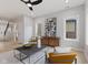 Well-lit living room showcases modern art, hardwood floors, and comfortable seating at 2406 Carrollton Ave, Indianapolis, IN 46205