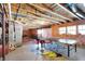Unfinished basement featuring exposed beams, ping pong table and plenty of space for activities at 2504 Boylston Ct, Zionsville, IN 46077