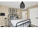 Stylish bedroom features modern decor, contemporary lighting, and comfortable furnishings at 2504 Boylston Ct, Zionsville, IN 46077