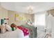 Bright bedroom featuring a comfortable bed, stylish decor, and large window for natural light at 2504 Boylston Ct, Zionsville, IN 46077