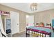 Cozy bedroom with unique light fixture, comfortable bed, and stylish decor at 2504 Boylston Ct, Zionsville, IN 46077