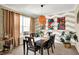 Inviting dining room featuring a stylish light fixture, modern art, and comfortable seating for six at 2504 Boylston Ct, Zionsville, IN 46077