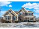Beautiful two-story home with a combination of stone and siding exterior and a well-manicured front yard at 2504 Boylston Ct, Zionsville, IN 46077