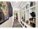Hallway with hardwood floors, built-in storage cubbies, and stylish decor at 2504 Boylston Ct, Zionsville, IN 46077