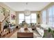 Inviting living room with hardwood floors, a decorative light fixture, and comfortable seating at 2504 Boylston Ct, Zionsville, IN 46077