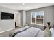 Bedroom features a large window, a television, and neutral paint at 3046 W New York St, Indianapolis, IN 46222