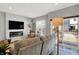 Bright living room with fireplace, large windows, and access to the outside balcony at 3046 W New York St, Indianapolis, IN 46222
