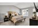 Spacious main bedroom with natural light, vaulted ceilings, and neutral decor at 3046 W New York St, Indianapolis, IN 46222