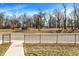 A beautiful view of trees beyond the street, offering a serene and natural setting at 3046 W New York St, Indianapolis, IN 46222