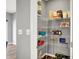 Organized pantry with wire shelving filled with food and household items, offering ample storage space at 3046 W New York St, Indianapolis, IN 46222