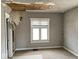 This bedroom has peeling paint and damaged ceiling at 3132 E 36Th St, Indianapolis, IN 46218