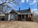 This two-story home features brick accents, a covered front porch, and a well-manicured lawn at 3132 E 36Th St, Indianapolis, IN 46218