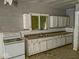 Kitchen featuring an electric oven, cabinetry, and a sink at 3132 E 36Th St, Indianapolis, IN 46218