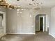 The living room showcases an archway and peeling paint at 3132 E 36Th St, Indianapolis, IN 46218