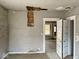 The room features peeling paint and damaged ceiling at 3132 E 36Th St, Indianapolis, IN 46218