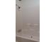 Clean bathroom featuring tiled walls and a shower and tub with silver fixtures at 3336 Fall Valley Dr, Columbus, IN 47203