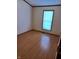 Bedroom with wood flooring and window providing plenty of natural light at 3336 Fall Valley Dr, Columbus, IN 47203