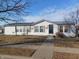 Charming single-story home featuring white siding and a neatly maintained front lawn at 3336 Fall Valley Dr, Columbus, IN 47203