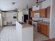 A kitchen area with white and wood cabinets, plenty of counter space, and modern appliances at 3336 Fall Valley Dr, Columbus, IN 47203