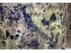 Aerial view of the property, buildings, pond, and tree perimeter at 3546 Stierwalt Rd, Quincy, IN 47456